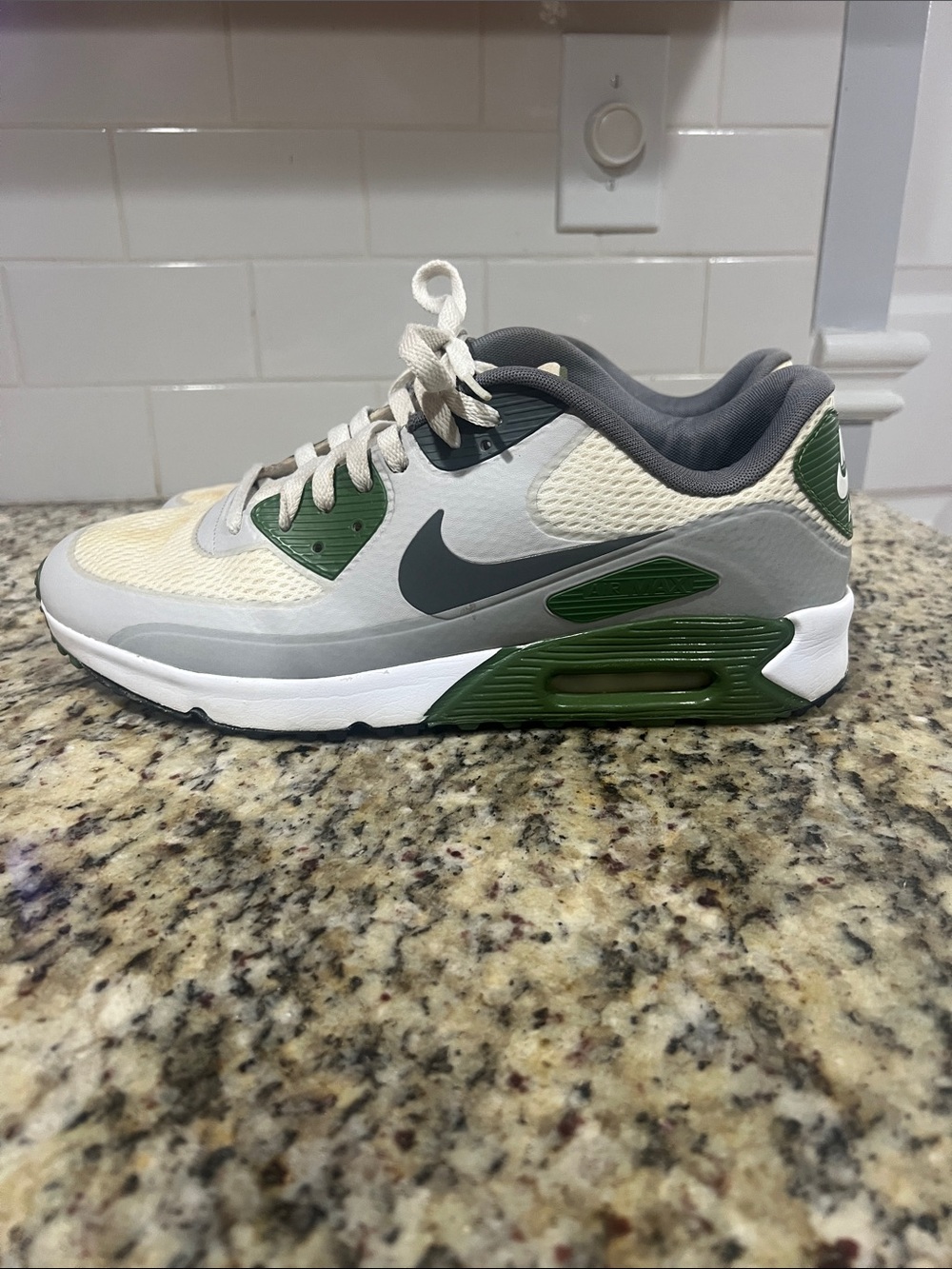 Nike gray, green and white athletic sneaker